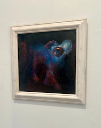 a painting of a cow in a white frame